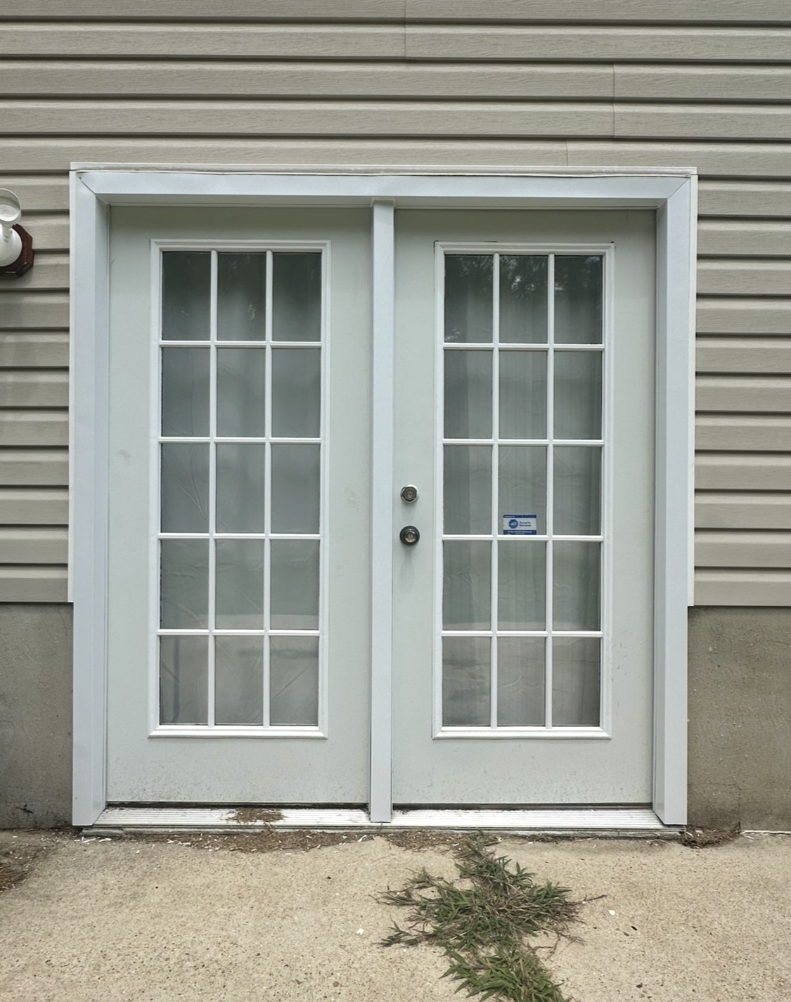 Basement French doors after new aluminum trim wrap protecting the wood from rot