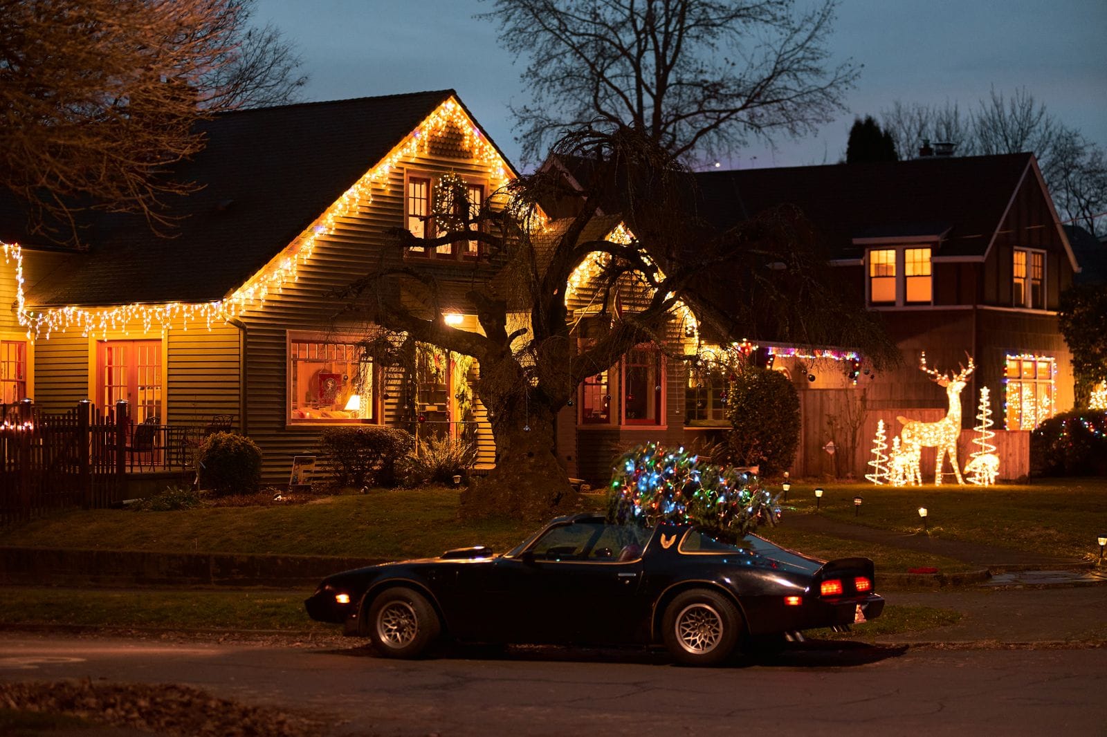 Warm white roofline lights at dusk